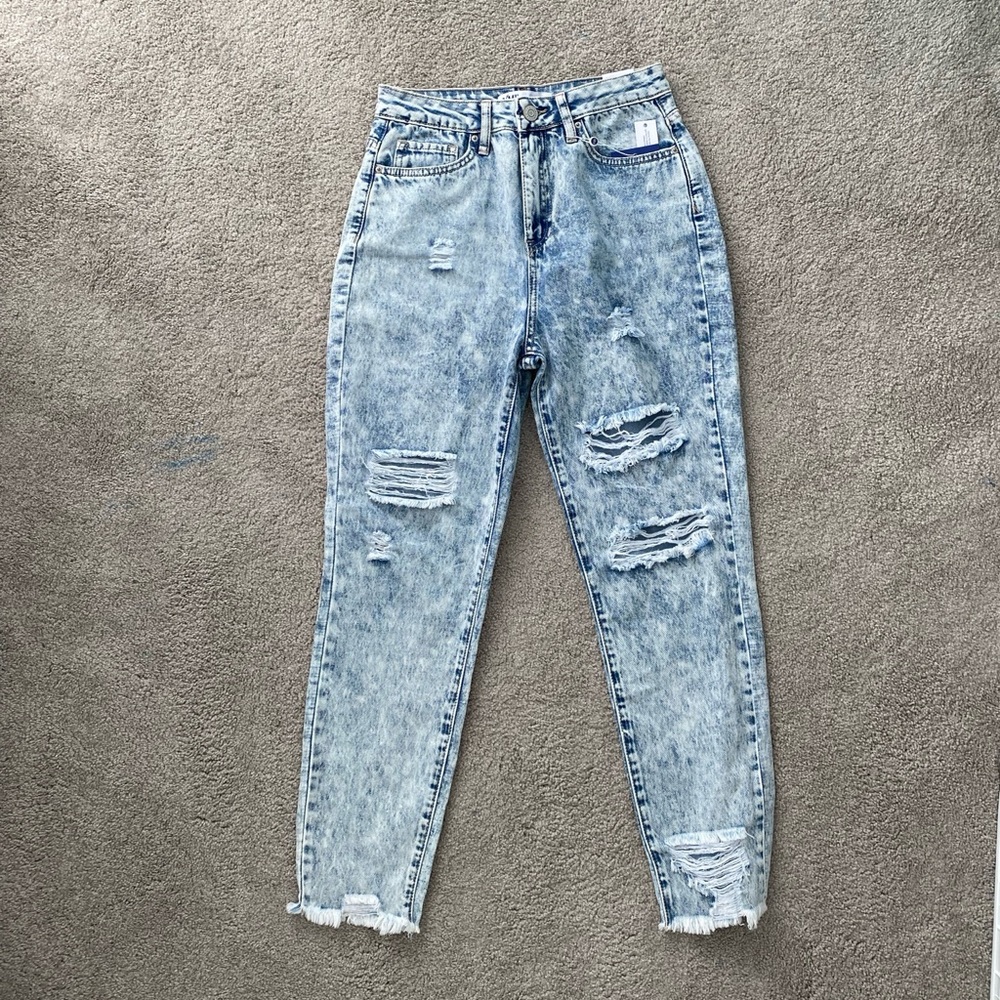 Acid washed jeans with rips